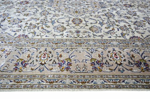 Full view of 2000s Kashan rug from Iran / Persia, 303 × 198 cm in Beige tones