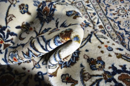 Close-up detail of 2000s Kashan rug from Iran / Persia showing Wool weave
