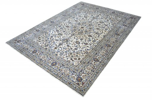 Corner detail of 2000s Kashan rug showing border pattern and Wool pile