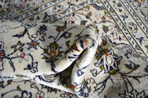 Close-up detail of 2000s Kashan rug from Iran / Persia showing Wool weave