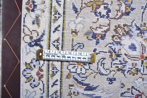 Surface texture of 2000s Kashan rug with natural Wool and intricate pattern