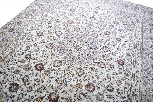 Backside of handmade 2000s Kashan rug showing knot structure and weave density
