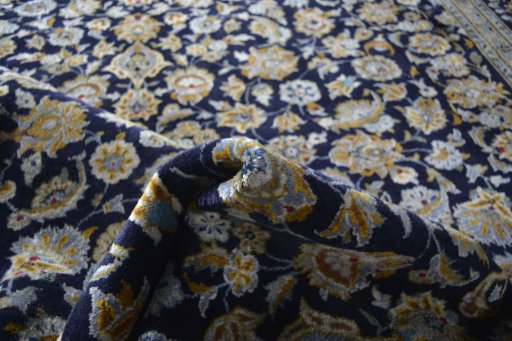 Surface texture of 2000s Kashan rug with natural Wool and intricate pattern