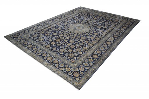 Corner detail of 2000s Kashan rug showing border pattern and Wool pile