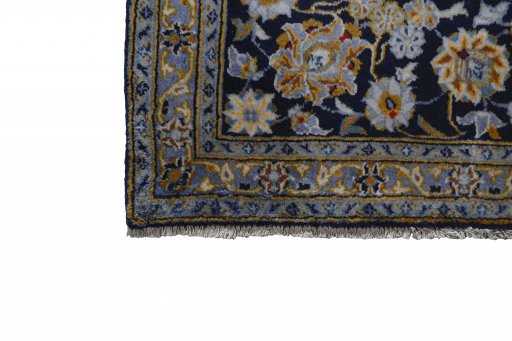 Close-up detail of 2000s Kashan rug from Iran / Persia showing Wool weave
