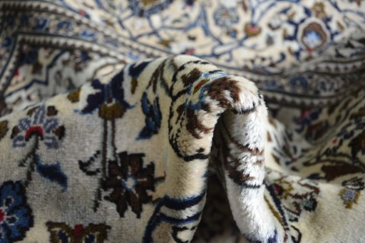 Close-up detail of 2000s Kashan rug from Iran / Persia showing Wool weave