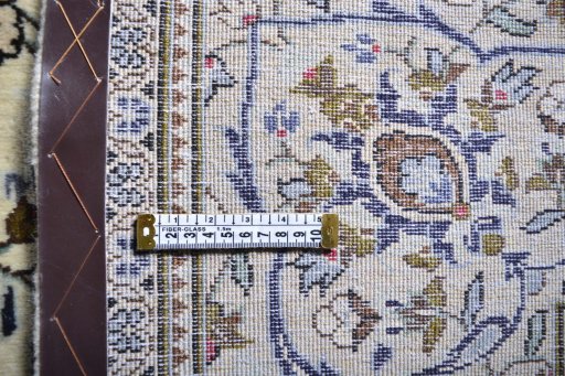 Surface texture of 2000s Kashan rug with natural Wool and intricate pattern