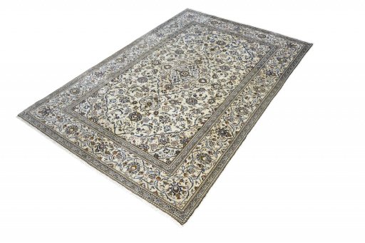 Corner detail of 2000s Kashan rug showing border pattern and Wool pile