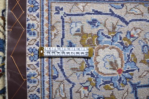 Surface texture of 2000s Kashan rug with natural Wool and intricate pattern