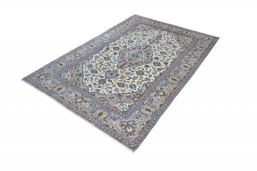 Corner detail of 2000s Kashan rug showing border pattern and Wool pile