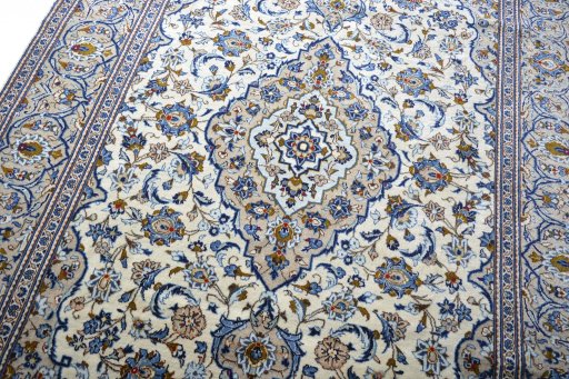 Backside of handmade 2000s Kashan rug showing knot structure and weave density