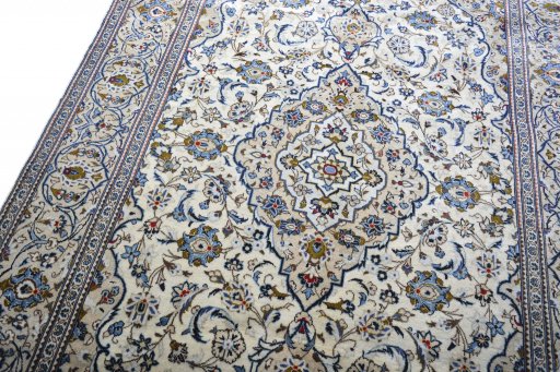 Backside of handmade 2000s Kashan rug showing knot structure and weave density