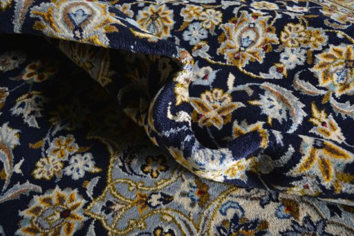 Close-up detail of 2000s Kashan rug from Iran / Persia showing Wool weave
