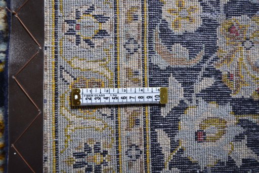 Surface texture of 2000s Kashan rug with natural Wool and intricate pattern