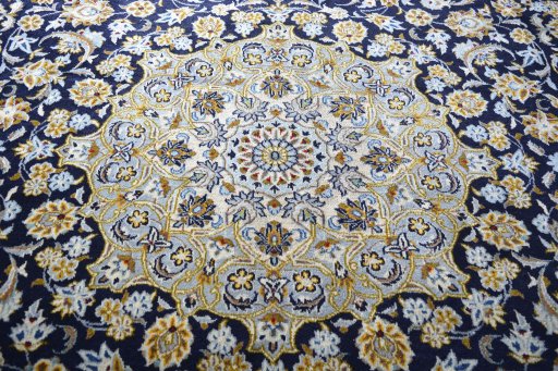 Central medallion detail of 2000s Kashan rug from Iran / Persia