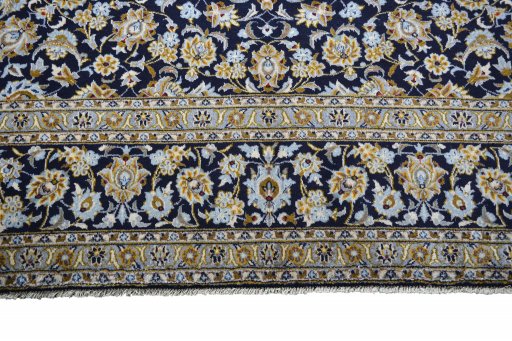 Close-up detail of 2000s Kashan rug from Iran / Persia showing Wool weave
