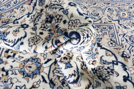 Close-up detail of 2000s Kashan rug from Iran / Persia showing Wool weave
