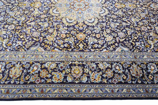 Corner detail of 2000s Kashan rug showing border pattern and Wool pile