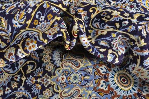 Surface texture of 2000s Kashan rug with natural Wool and intricate pattern