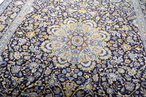 Backside of handmade 2000s Kashan rug showing knot structure and weave density