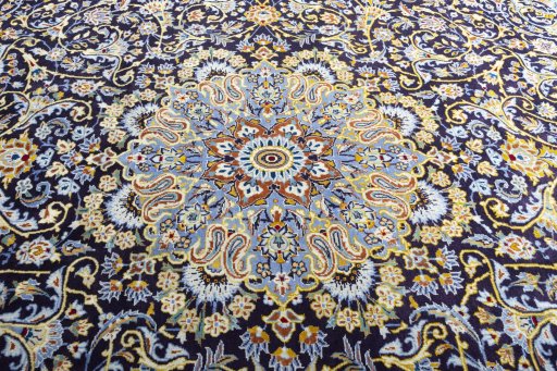 Central medallion detail of 2000s Kashan rug from Iran / Persia
