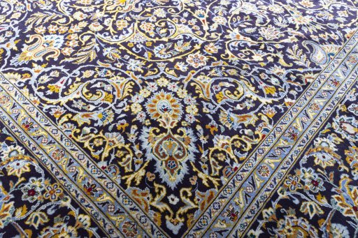 Close-up detail of 2000s Kashan rug from Iran / Persia showing Wool weave