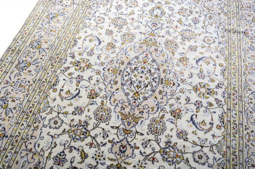 Backside of handmade 2000s Kashan rug showing knot structure and weave density