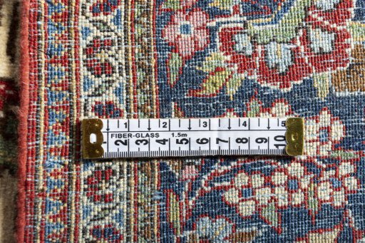 Backside of handmade 1930s Kashan rug showing knot structure and weave density