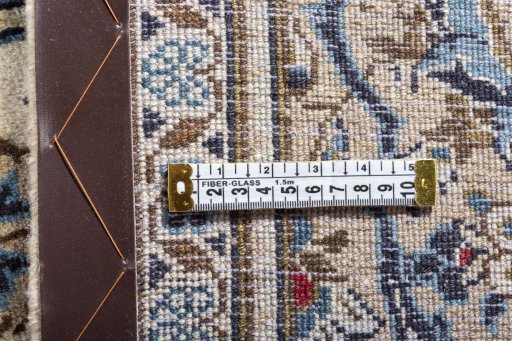 Surface texture of 2000s Kashan rug with natural Wool and intricate pattern