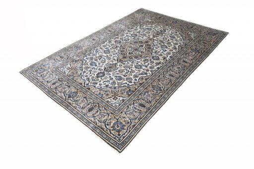 Corner detail of 2000s Kashan rug showing border pattern and Wool pile