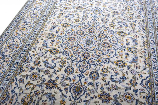 Backside of handmade 2000s Kashan rug showing knot structure and weave density