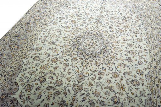 Backside of handmade 2000s Kashan rug showing knot structure and weave density