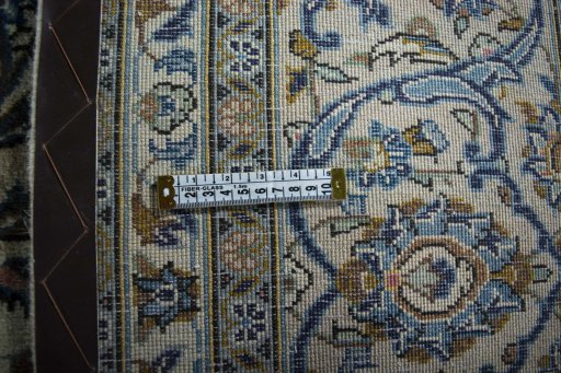 Surface texture of 2000s Kashan rug with natural Wool and intricate pattern