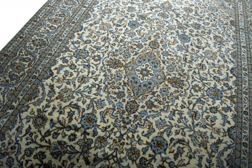 Backside of handmade 2000s Kashan rug showing knot structure and weave density