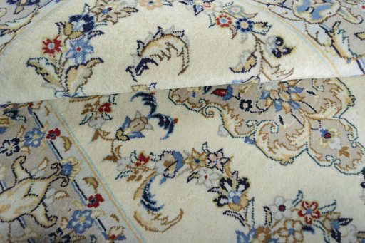 Corner detail of New Kashan rug showing border pattern and Wool pile