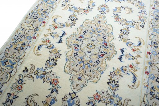 Backside of handmade New Kashan rug showing knot structure and weave density