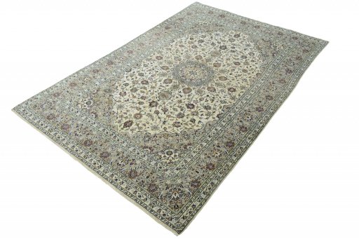Corner detail of 2000s Kashan rug showing border pattern and Wool pile