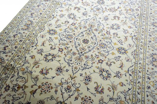 Backside of handmade New Kashan rug showing knot structure and weave density