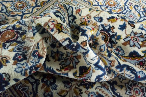 Close-up detail of 2000s Kashan rug from Iran / Persia showing Wool weave