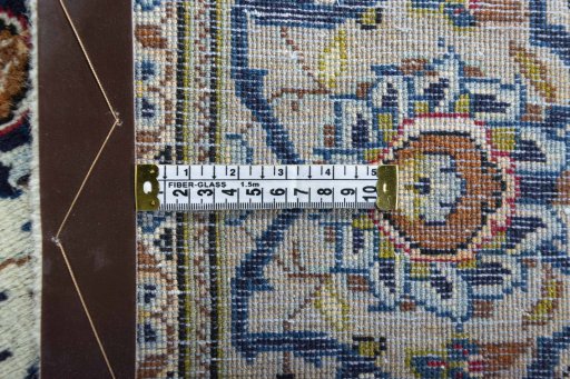 Surface texture of 2000s Kashan rug with natural Wool and intricate pattern