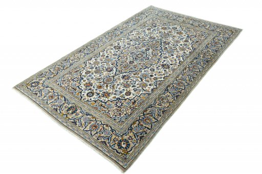 Corner detail of 2000s Kashan rug showing border pattern and Wool pile