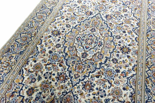 Backside of handmade 2000s Kashan rug showing knot structure and weave density