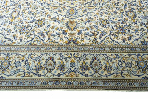 Corner detail of New Kashan rug showing border pattern and Wool pile