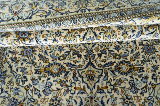 Close-up detail of New Kashan rug from Iran / Persia showing Wool weave