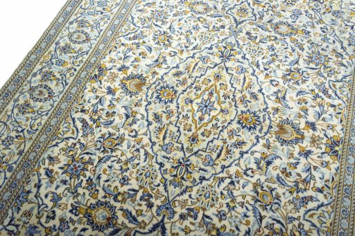 Backside of handmade New Kashan rug showing knot structure and weave density