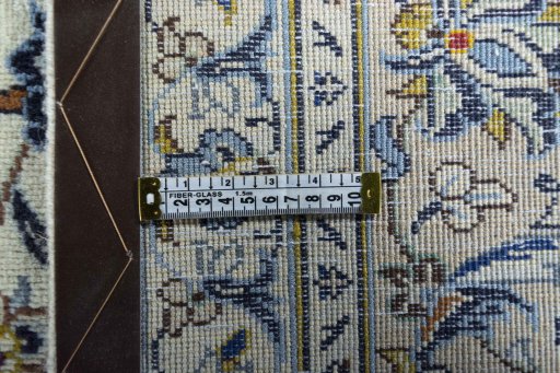 Backside of handmade 2000s Kashan rug showing knot structure and weave density