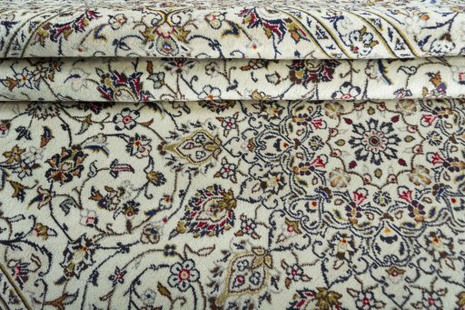 Close-up detail of 2000s Kashan rug from Iran / Persia showing Wool weave