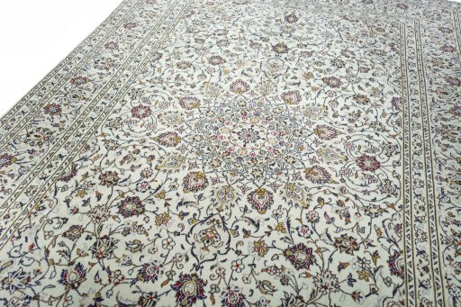 Backside of handmade 2000s Kashan rug showing knot structure and weave density
