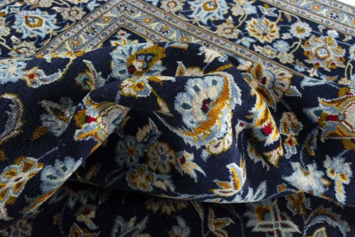 Surface texture of 2000s Kashan rug with natural Wool and intricate pattern