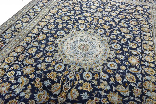 Backside of handmade 2000s Kashan rug showing knot structure and weave density